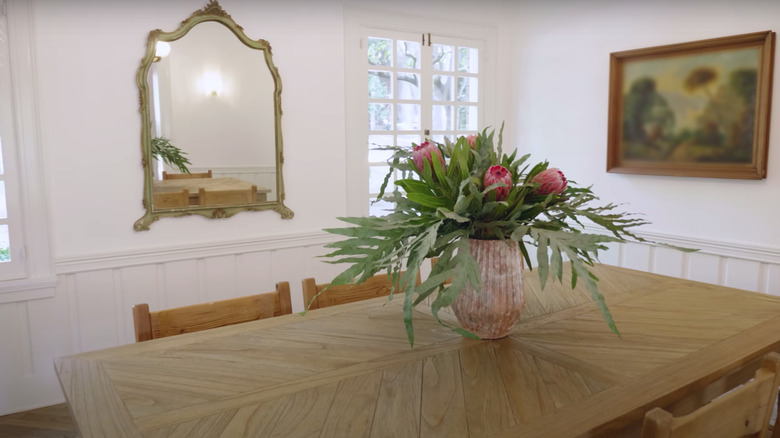 dining room with flower bouquet