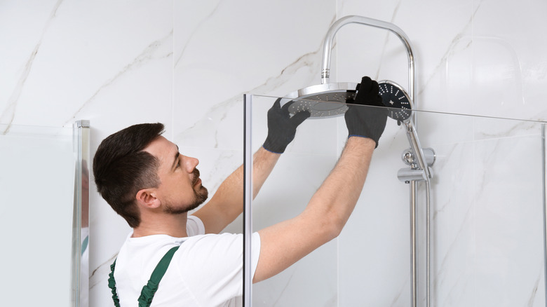 Person installing showerhead