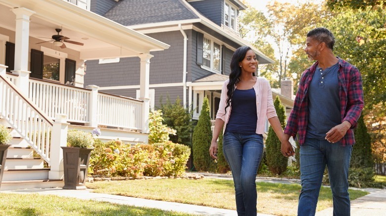 couple walking outside in suburbs