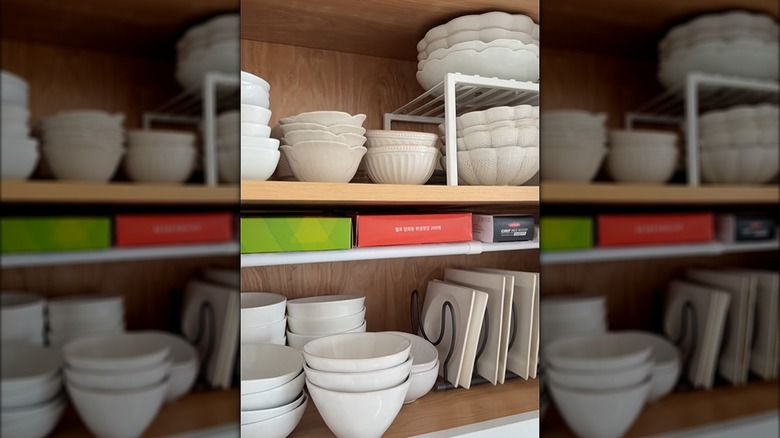 This screenshot from an Instagram video shows how two thin tension rods become a shelf in a cabinet.