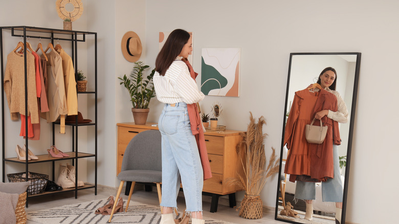 Woman looking at herself in the mirror