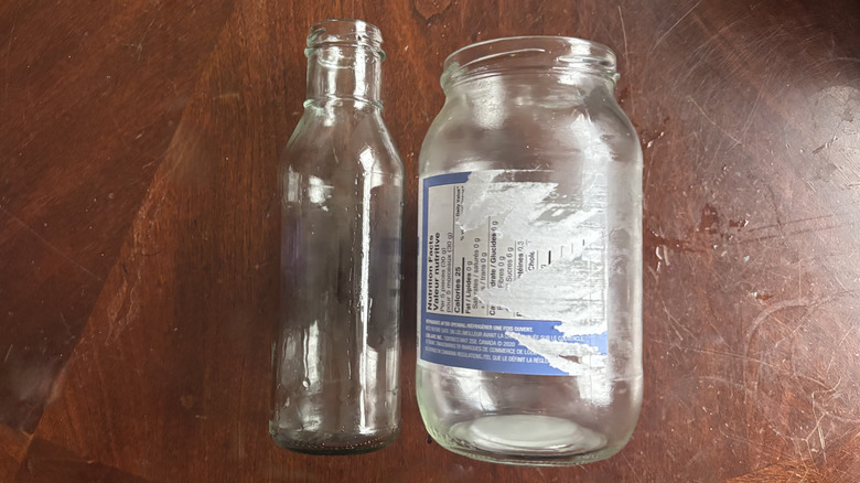 Two jars on a table: one without a label and one with a ripped label.