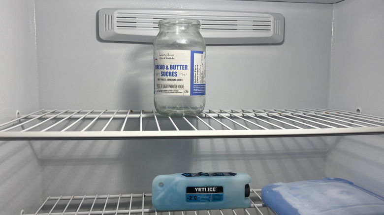 An empty pickle jar in a freezer