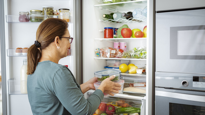 Putting food containers in refrigerator