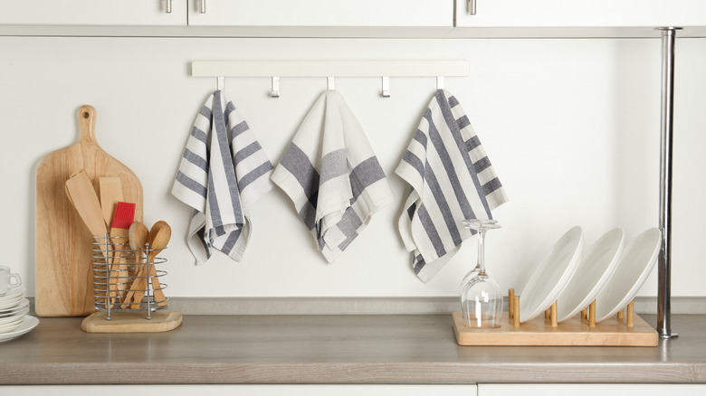 towels hanging along kitchen backsplash