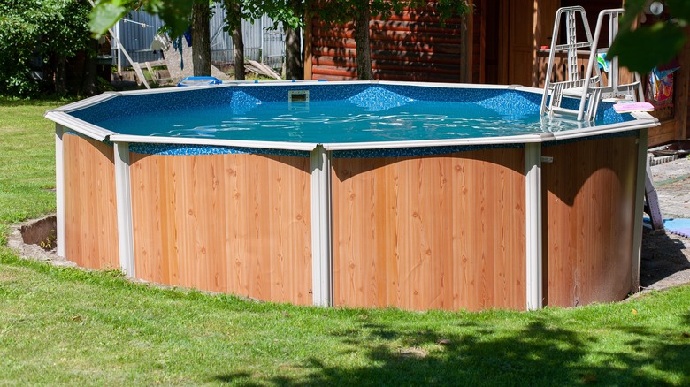 Semi-above ground pool with ladder