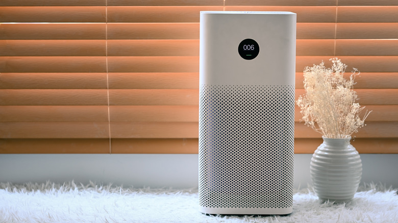 white air purifier with vase