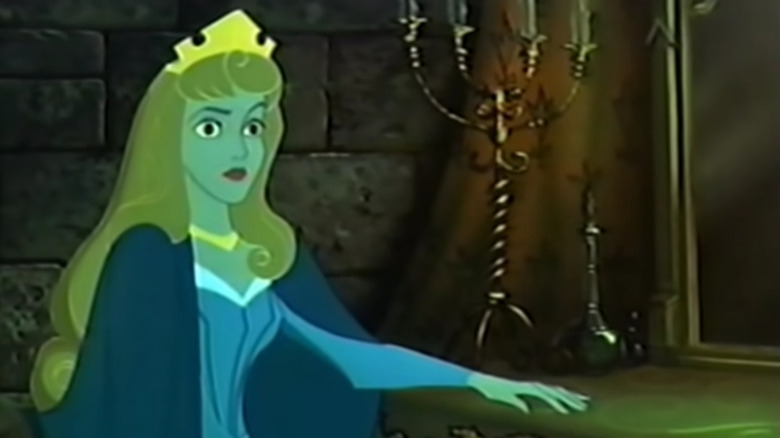 Princess Aurora stands by candelabra