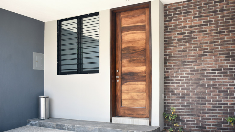 Modern multicolor stained wood door at front entry