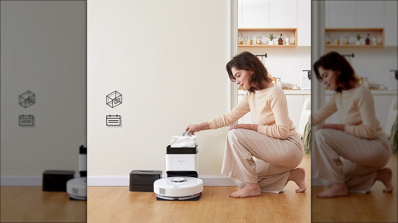 woman with robot vacuum
