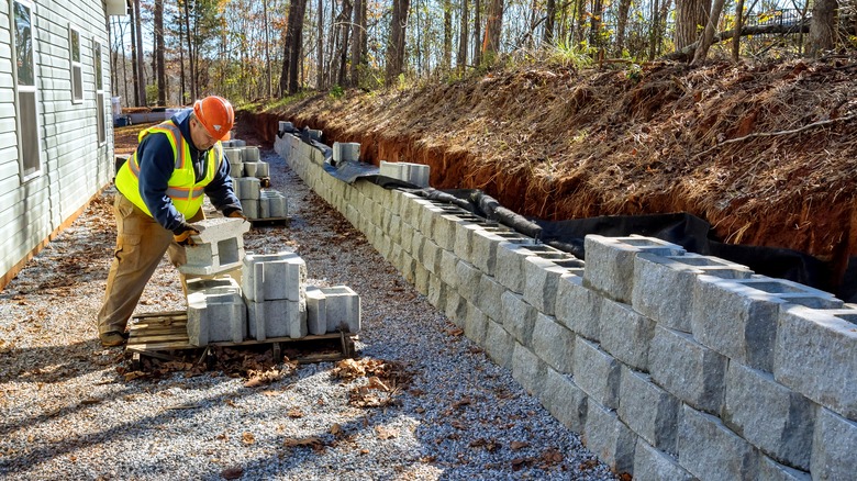 Man building a retaining wall