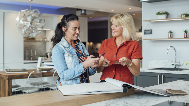 Two women looking at countertop options