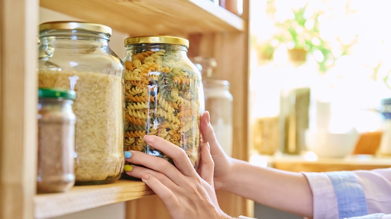 Woman organizing pantry