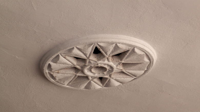 A detailed medallion on the ceiling