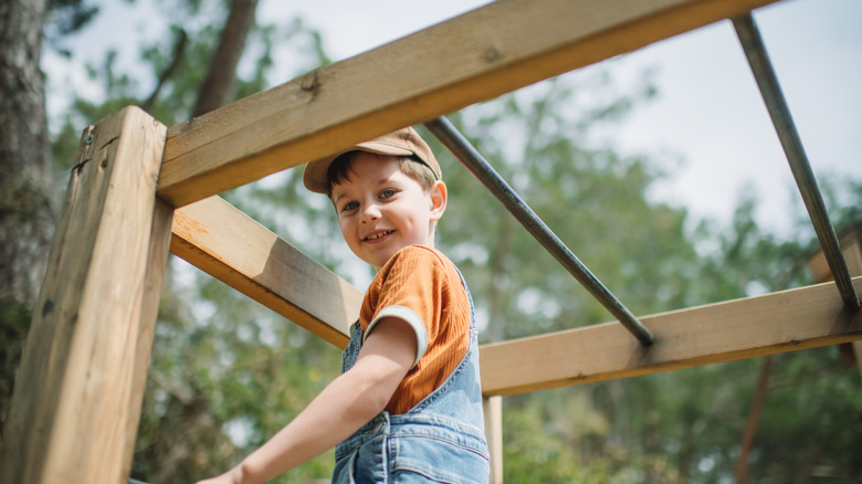 Child playing on monkey bars