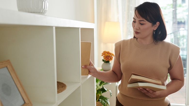 Placing books on bookcase