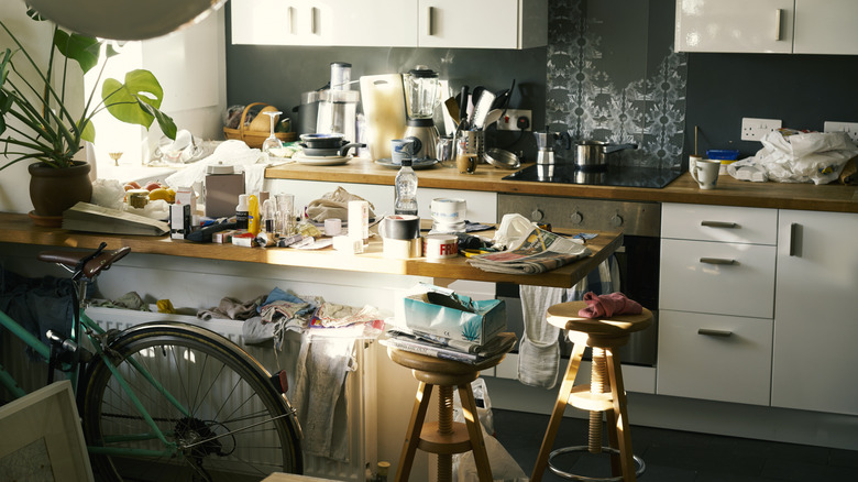 Cluttered kitchen with messy countertops