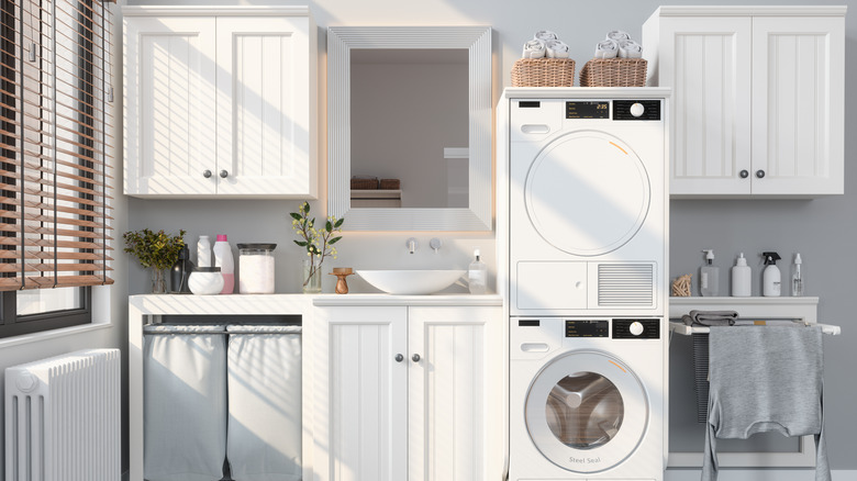 laundry room with multiple cabinets