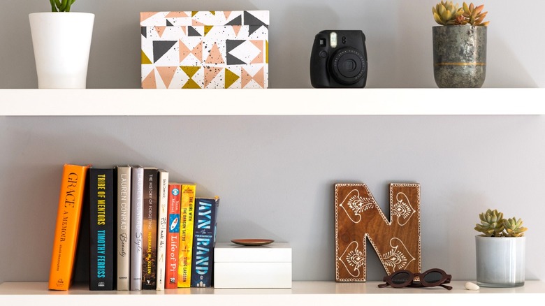 white floating shelves with accessories