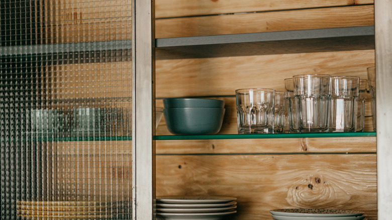 Cabinet with sliding textured door