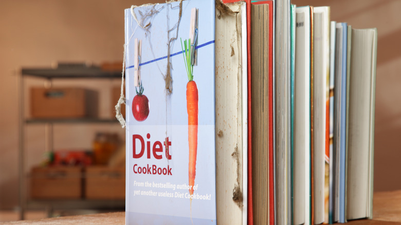 Cookbooks lined up on a countertop