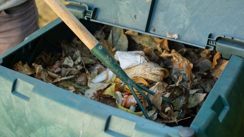 rake in compost bin