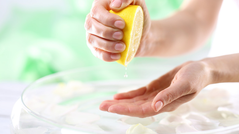Squeezing a fresh lemon