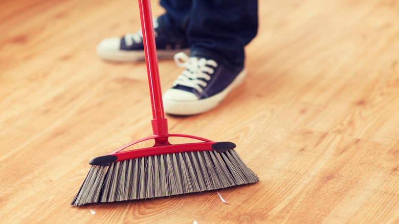 Broom sweeping floor