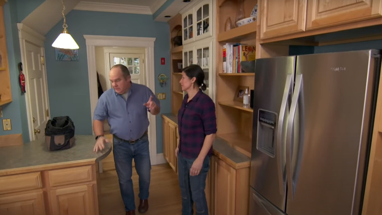 Man and woman near fridge