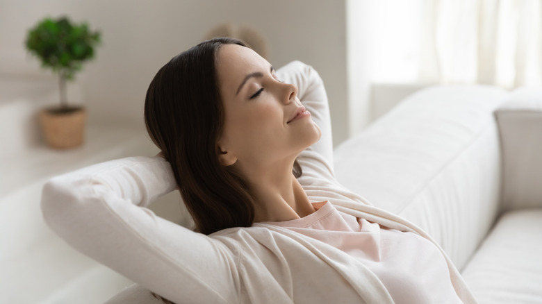 Woman relaxing in fresh home environment