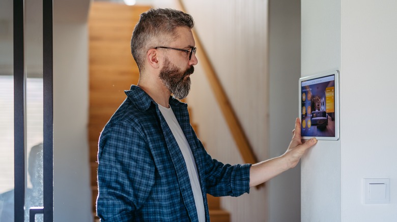 Man controlling smart home system