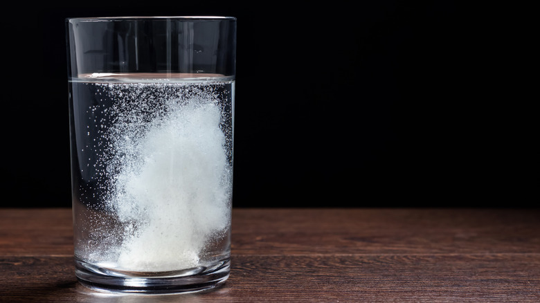 Alka Seltzer tablet in water glass