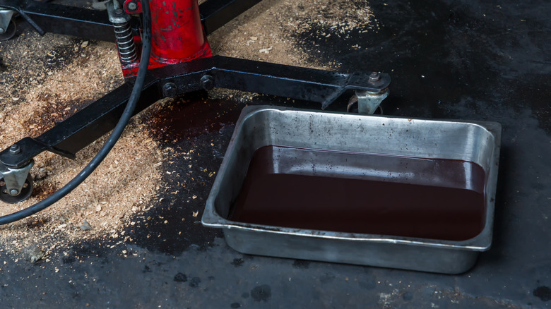 tray of drained motor oil