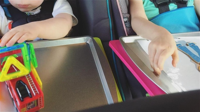 kids in car with cookie sheet