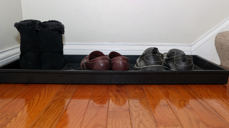 black shoe tray by door