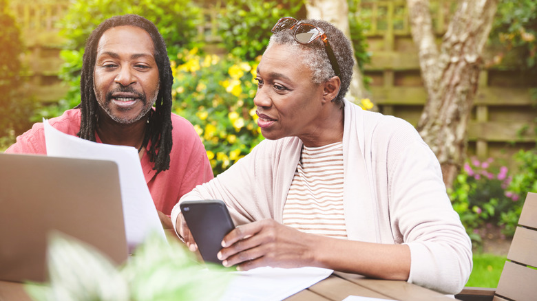 Couple using tech devices