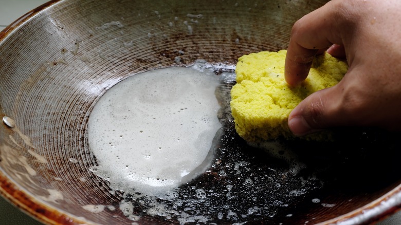 Scrubbing dirty pan