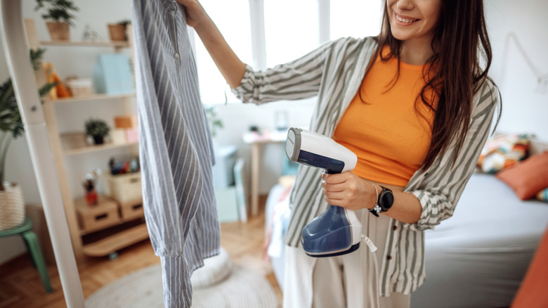 Woman steaming clothes