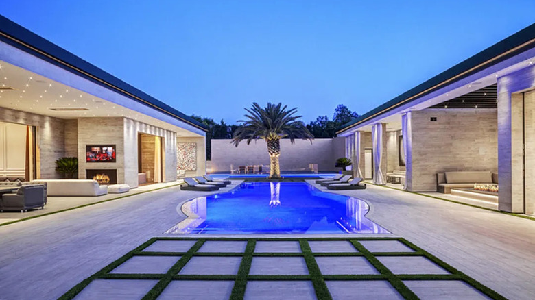 modern mansion pool at dusk