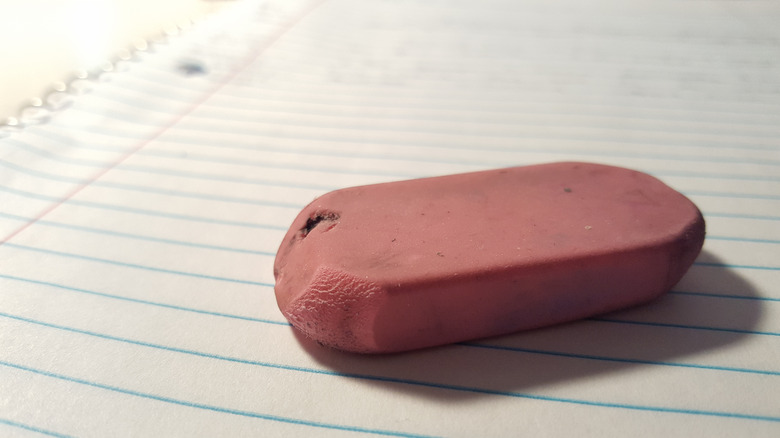 worn down pink rubber eraser
