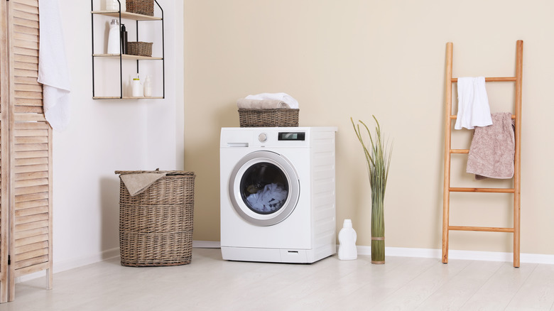 ladder holding towels in laundry room