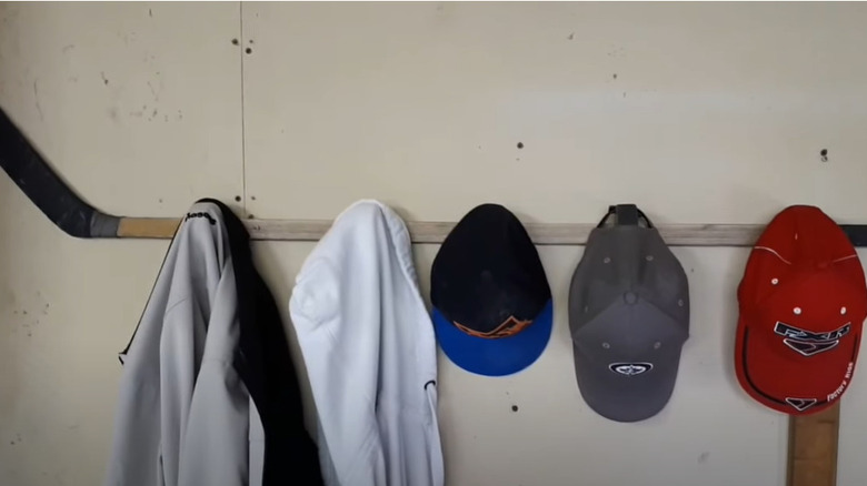  hockey stick rack with coats and hats