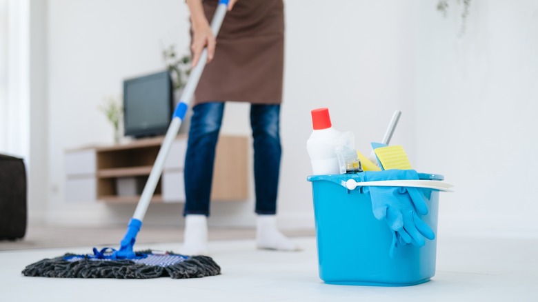 Person mopping floor 