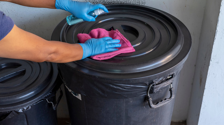 Wiping down trash can