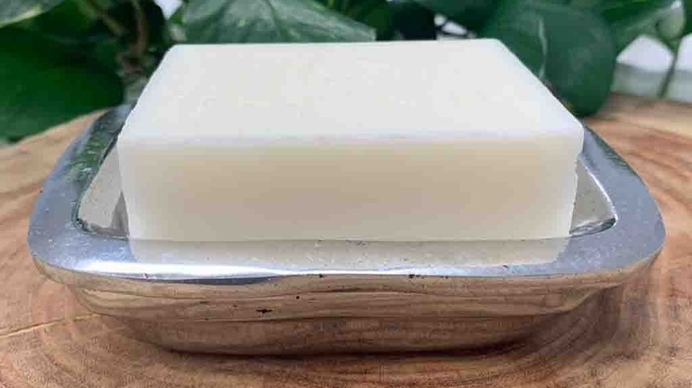 bar soap sitting in aluminum holder