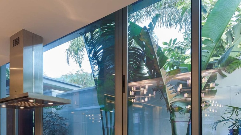 sliding glass door with privacy film with garden view