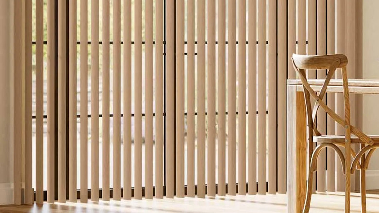 imitation wood vertical blinds over sliding door in daytime