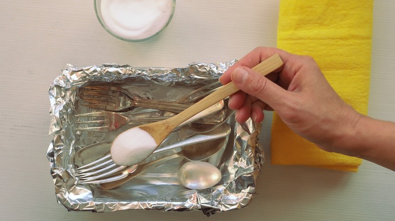 Silverware in baking soda solution