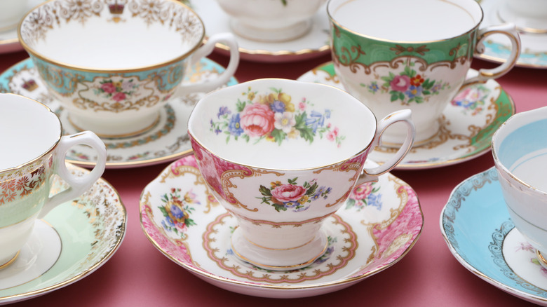 A variety of vintage china tea cups.