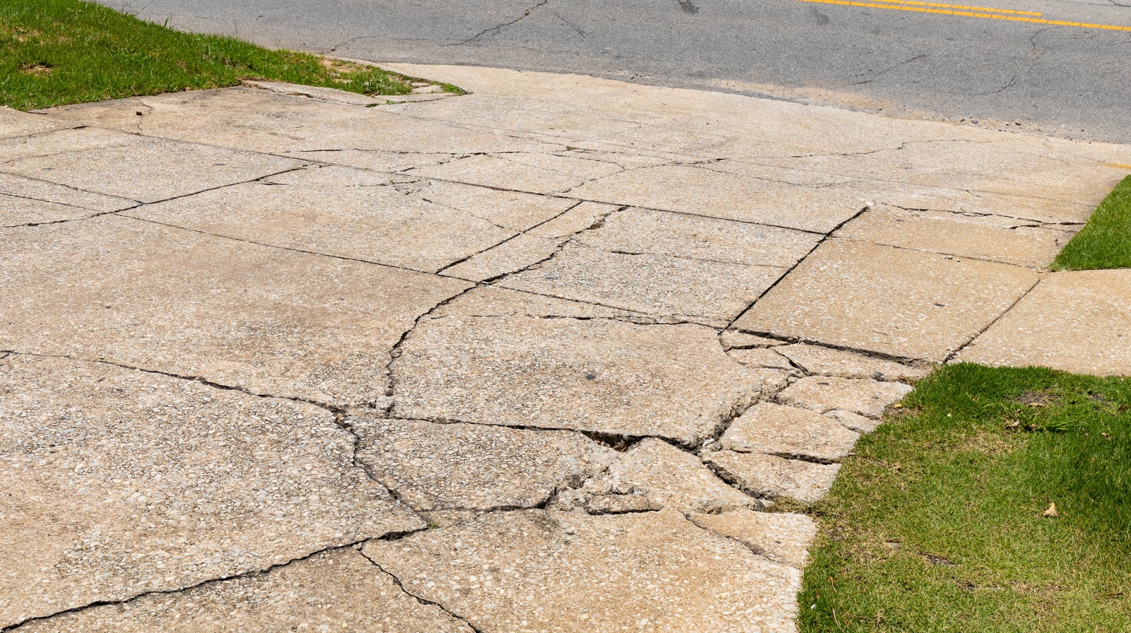 An Expert Explains How To Repair Concrete Cracks In Your Driveway